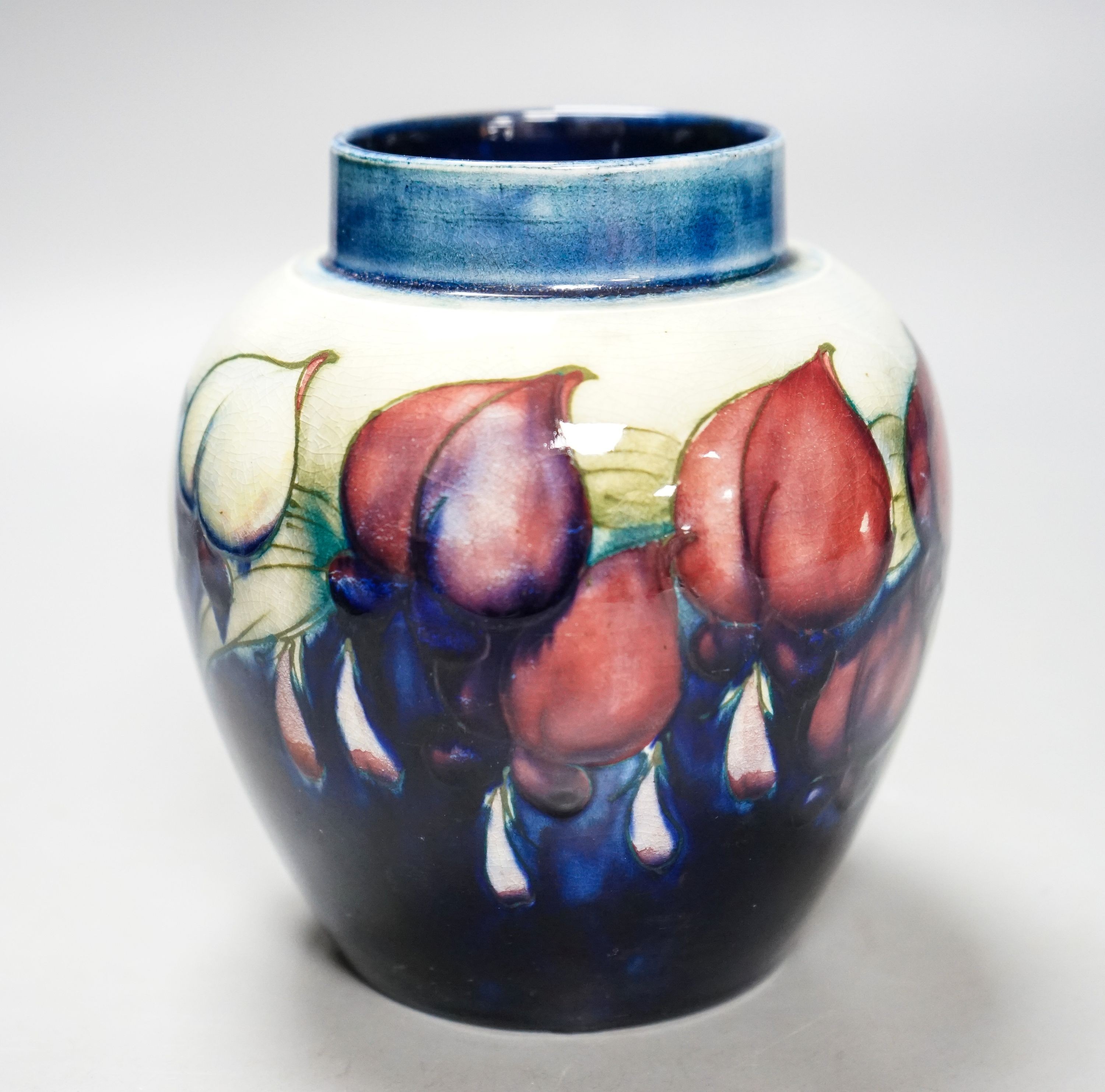 A Moorcroft wisteria pattern jar 13cm